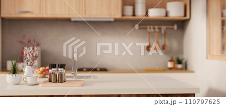 A copy space on a modern kitchen island with seasoning bottles in a modern, Scandinavian kitchen. A copy space on a modern kitchen island with seasoning bottles in a modern, Scandinavian kitchen. 110797625