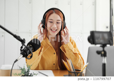 Live Podcast Session with Smiling Female Host. 110799707
