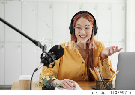Live Podcast Session with Smiling Female Host. Live Podcast Session with Smiling Female Host. 110799715