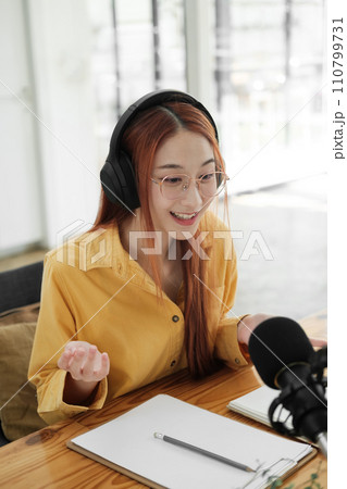 Live Podcast Session with Smiling Female Host. Live Podcast Session with Smiling Female Host. 110799731