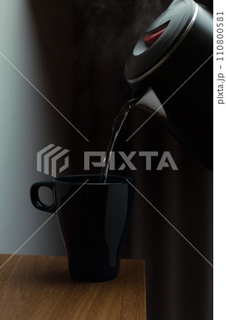 Pouring hot water 110800581