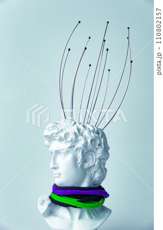 Antique male David statue's head with manual Massager for head isolated on a white background. 3d trendy cretive collage in magazine style. 3d contemporary art. Modern design 110802157