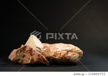 Pieces of granite stone on black background studio shot 110804755