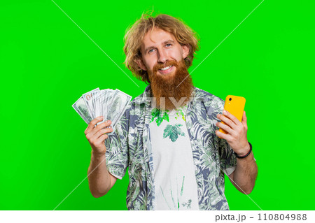 Happy man use smartphone rejoicing game win, receiving money dollar cash, celebrating success Happy man use smartphone rejoicing game win, receiving money dollar cash, celebrating success 110804988