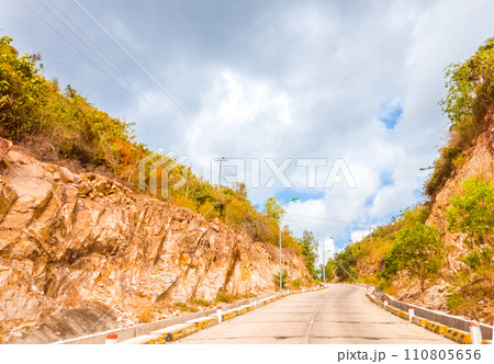 Bright sunshine day time Highway curve road overpass nature landscape background street tall lanterns trees bushes sideway 110805656