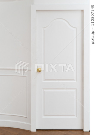 gold door knob handle. reflective surface and modern design add touch of luxury to entrance door. Crafted with metal and wood, this round knob shines with style and security. gold door knob handle. reflective surface and modern design add touch of luxury to entrance door. Crafted with metal and wood, this round knob shines with style and security. 110807549
