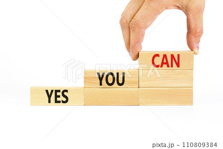 Motivational and Yes you can symbol. Concept words Yes you can on beautiful wooden blocks. Beautiful white background. Businessman hand. Business motivational and Yes you can concept. Copy space. Motivational and Yes you can symbol. Concept words Yes you can on beautiful wooden blocks. Beautiful white background. Businessman hand. Business motivational and Yes you can concept. Copy space. 110809384