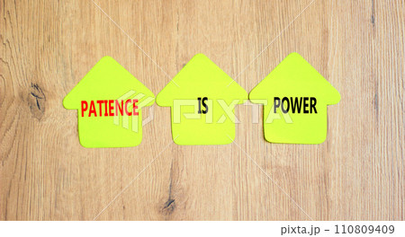 Patience is power symbol. Concept words Patience is power on beautiful yellow paper houses. Beautiful wooden table wooden background. Business and patience is power concept. Copy space. 110809409