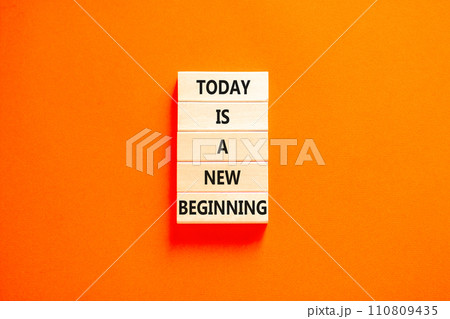 Today is a new beginning symbol. Concept words Today is a new beginning on wooden blocks. Beautiful orange table orange background. Business today is a new beginning concept. Copy space. 110809435