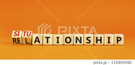 Relationship or situationship symbol. Concept word Relationship situationship on wooden cubes. Beautiful orange table orange background. Business relationship situationship concept. Copy space. 110809486
