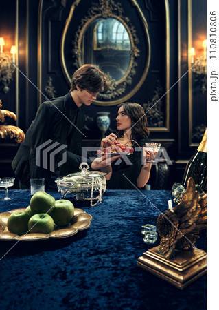 Photo story in lifestyle magazine about elite social scene. Romantic film scene depiction with drama theme. Photo story in lifestyle magazine about elite social scene. Romantic film scene depiction with drama theme. 110810806