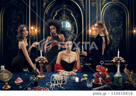 Promotional imagery for a VIP event hosting service. Beautiful young women in elegant dresses attending luxurious place for dinner Promotional imagery for a VIP event hosting service. Beautiful young women in elegant dresses attending luxurious place for dinner 110810819