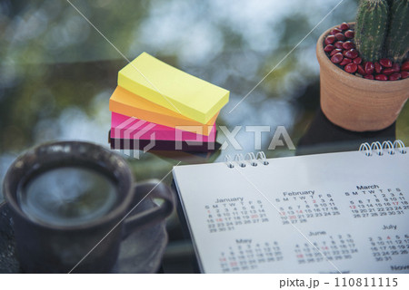2024 Calendar event planner timetable agenda plan on organize schedule event. Wedding planner agenda organizing timetable by organizer schedule. Calendar desk objects on office table in green park 110811115