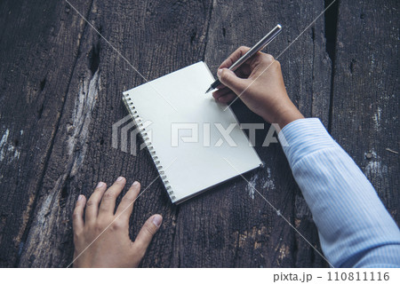 Businesswoman hands note document. Hands writing on empty notebook. Woman planning working on eco sustainable outdoors. Female hand holding pencil write on blank sketchbook. Mock-up Concept Businesswoman hands note document. Hands writing on empty notebook. Woman planning working on eco sustainable outdoors. Female hand holding pencil write on blank sketchbook. Mock-up Concept 110811116