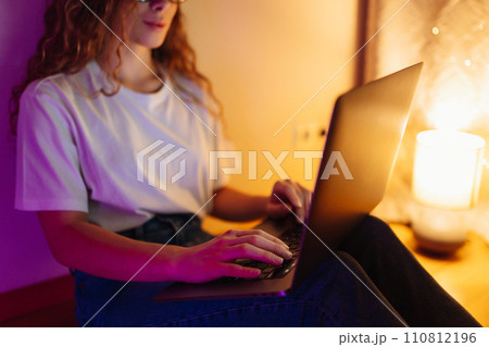 Young woman with laptop. Freelance or studying concept. Online training, shopping, blogging. 110812196