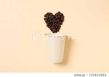 Heart shape from coffee on a yellow background. 110812883