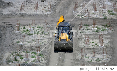Kiev, Ukraine March 13, 2019: Tractors and excavators work on the construction of the foundation zero cycle Kiev, Ukraine March 13, 2019: Tractors and excavators work on the construction of the foundation zero cycle 110813192