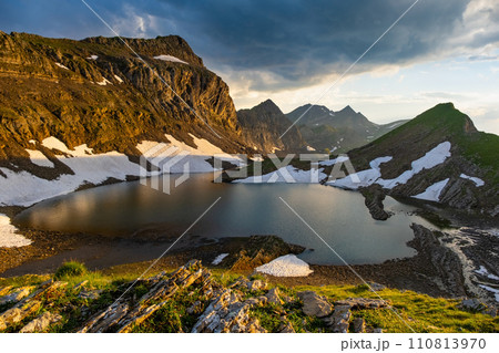 highland lake in Swiss Alps mountains. Small lake in highlands. Alpine valley Grindelwald. Jungfrau region, Switzerland. 110813970