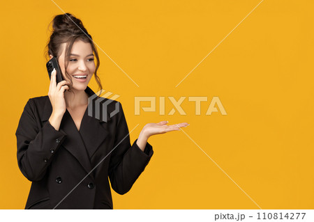 Attractive young business lady with a smartphone in her hands Attractive young business lady with a smartphone in her hands 110814277