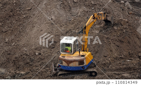Kiev, Ukraine, October 17, 2018: Workers in the mud of a construction site at the stage of excavation; construction of a supermarket AUCHAN 110814349