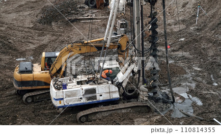 Kiev, Ukraine, October 17, 2018: Workers in the mud of a construction site at the stage of excavation; construction of a supermarket AUCHAN 110814355