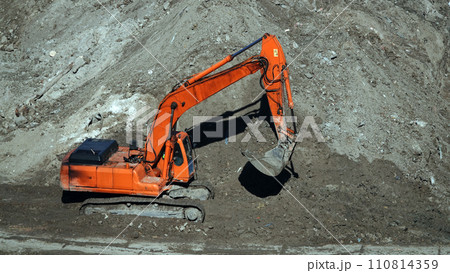 Kiev, Ukraine, October 17, 2018: Workers in the mud of a construction site at the stage of excavation; construction of a supermarket AUCHAN Kiev, Ukraine, October 17, 2018: Workers in the mud of a construction site at the stage of excavation; construction of a supermarket AUCHAN 110814359