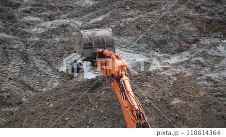 Kiev, Ukraine, October 17, 2018: Workers in the mud of a construction site at the stage of excavation; construction of a supermarket AUCHAN 110814364