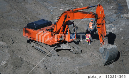 Kiev, Ukraine, October 17, 2018: Workers in the mud of a construction site at the stage of excavation; construction of a supermarket AUCHAN 110814366