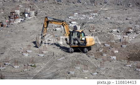 Kiev, Ukraine, October 17, 2018: Workers in the mud of a construction site at the stage of excavation; construction of a supermarket AUCHAN 110814413