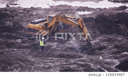 Kiev, Ukraine March 13, 2019:  Tractors and excavators work on the construction of the foundation zero cycle 110814467