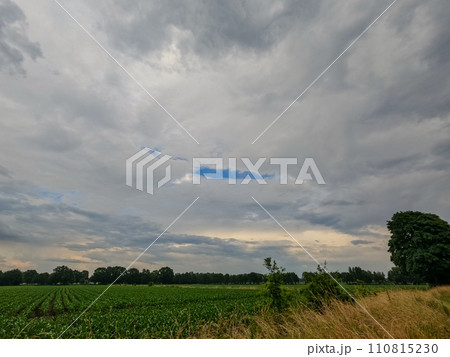Calm Before the Storm: Farmland and Approaching Clouds 110815230