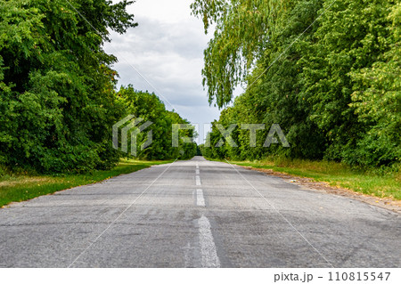 Beautiful empty asphalt road in countryside on colored background Beautiful empty asphalt road in countryside on colored background 110815547