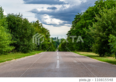 Beautiful empty asphalt road in countryside on colored background Beautiful empty asphalt road in countryside on colored background 110815548