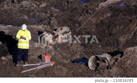 Kiev, Ukraine March 13, 2019: Workers - zero-cycle construction of the foundation of an entertainment center Kiev, Ukraine March 13, 2019: Workers - zero-cycle construction of the foundation of an entertainment center 110816285