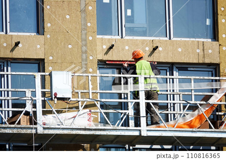 Kiev, Ukraine March 18, 2020: Workers at high altitude Kiev, Ukraine March 18, 2020: Workers at high altitude 110816365