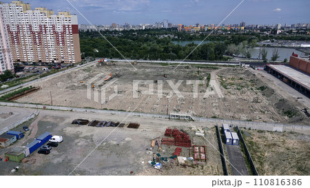 Kiev, Ukraine March 13, 2019: Tractors and excavators work on the construction of the foundation zero cycle Kiev, Ukraine March 13, 2019: Tractors and excavators work on the construction of the foundation zero cycle 110816386