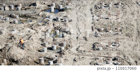 Kiev, Ukraine March 13, 2019: Workers - zero-cycle construction of the foundation of an entertainment center Kiev, Ukraine March 13, 2019: Workers - zero-cycle construction of the foundation of an entertainment center 110817060