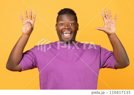 Excited African man raising both hands showing number nine, studio Excited African man raising both hands showing number nine, studio 110817135