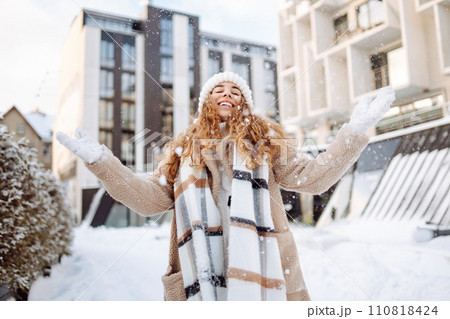 Portrait of young woman in the winter street. Fashion style. Portrait of young woman in the winter street. Fashion style. 110818424