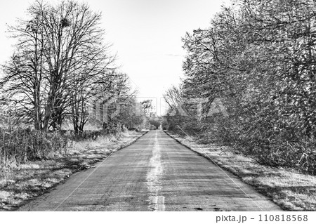 Beautiful empty asphalt road in countryside on colored background 110818568