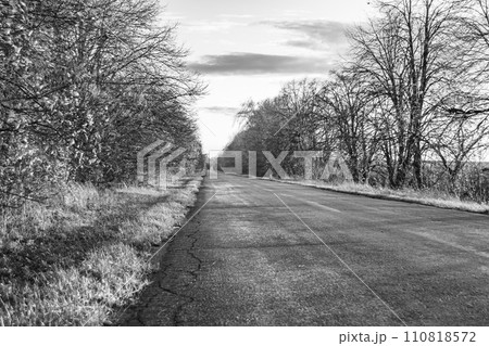 Beautiful empty asphalt road in countryside on colored background 110818572