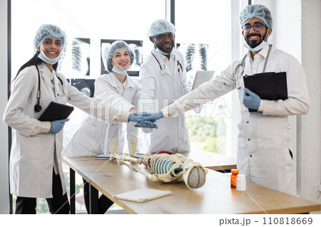 Group of multi ethnic medical specialists looking at camera 110818669