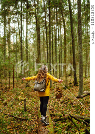 Happy woman enjoying green beautiful nature woods forest. Concept of healthy natural lifestyle. Happy woman enjoying green beautiful nature woods forest. Concept of healthy natural lifestyle. 110818859