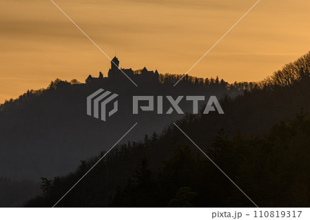 Silhouette of the Haut Koenigsbourg castle on the top of a mountain. 110819317