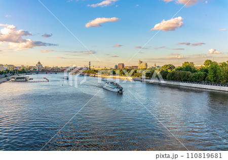 Cruise ship sails on the Moscow river in Moscow city center, popular place for walking. Cruise ship sails on the Moscow river in Moscow city center, popular place for walking. 110819681