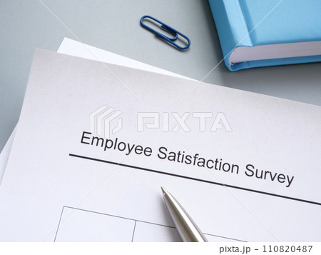Employee satisfaction survey and pen on the table. 110820487