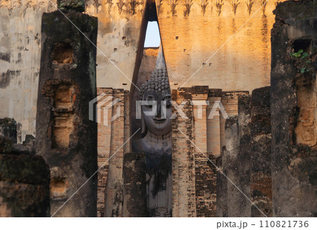 The buddha in Wat Si Chum in Sukhothai Historical Park, pagoda stupa, Sukhothai, Thailand. Thai buddhist temple architecture. Tourist attraction. 110821736