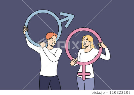 Couple of man and woman hold gender badges and smile, feeling respect for opposite sex 110822105