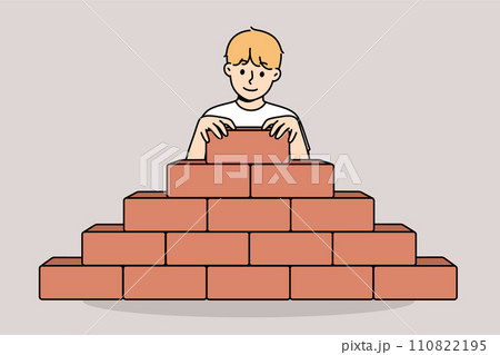 Little boy builds pyramid bricks, wanting to become builder and enroll in architectural university Little boy builds pyramid bricks, wanting to become builder and enroll in architectural university 110822195