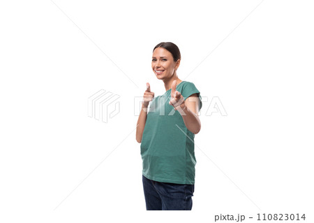 young joyful positive black-haired woman in a green basic t-shirt on a white background with copy young joyful positive black-haired woman in a green basic t-shirt on a white background with copy 110823014